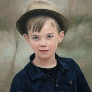 The Little Boy Wearing a Hat